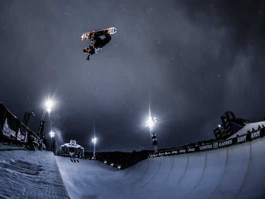Snowboarder Ben Ferguson jumping out of the halfpipe at Aspen X Games 2016