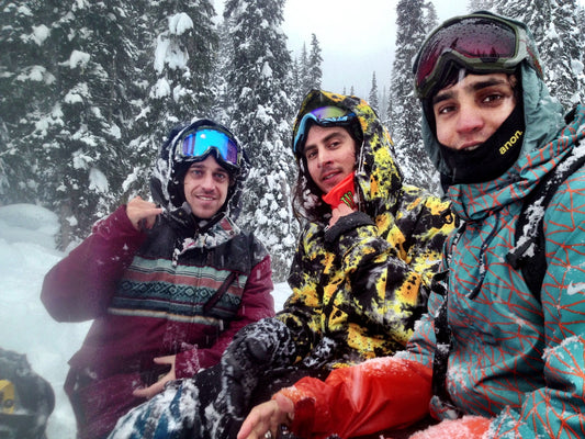 Three snowboarders posing for a portrait in Revelstoke, British Columbia