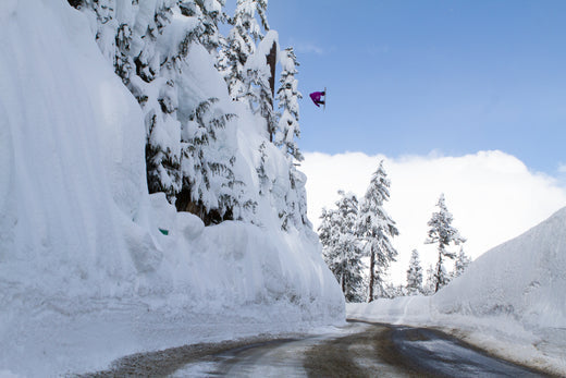 Snowboarder Hana Beaman jumping over the Mt. Baker Road Gap