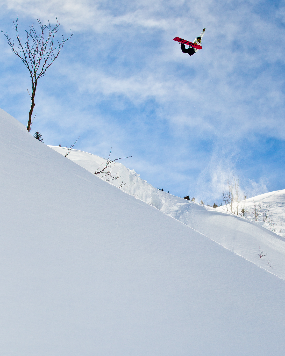 Snowboarder Manuel Diaz does a method air in Portes Du Soleil, Switzerland