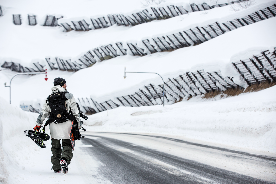 Snowboarder Torstein Horgmo walking in Hokkaido, Japan